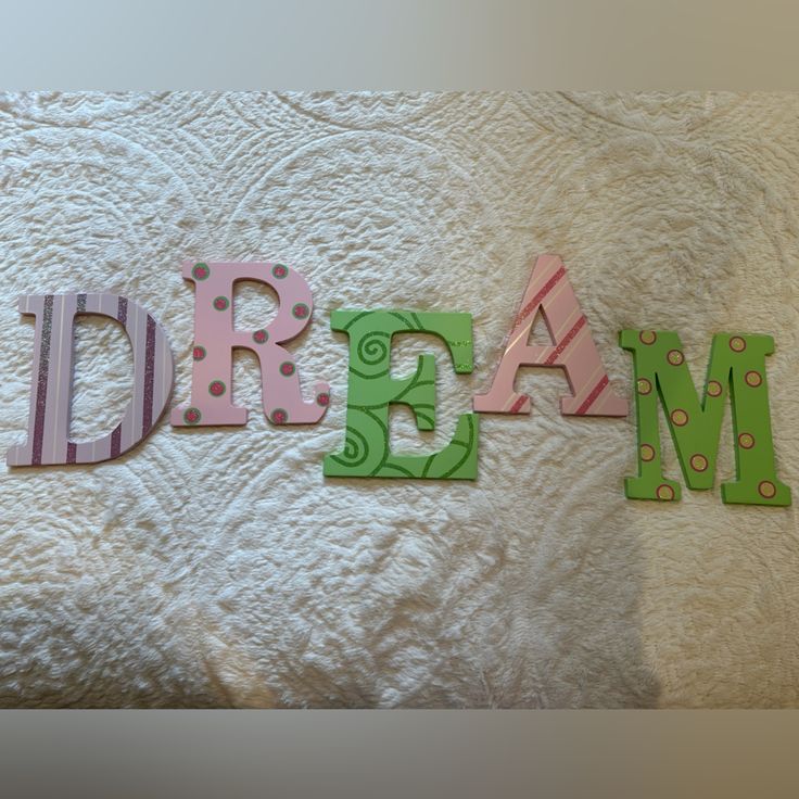 Set Of Colorful Wooden Letters That Spell Out Dream 8”. Vary