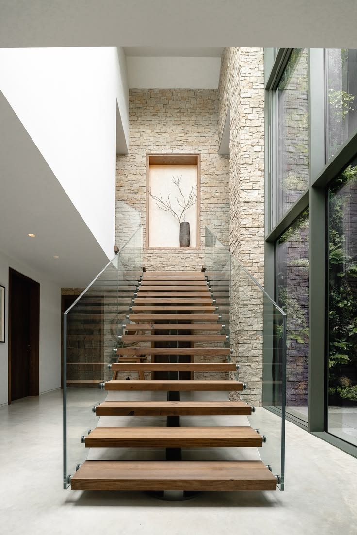 A striking floating staircase creates the focal point of thi