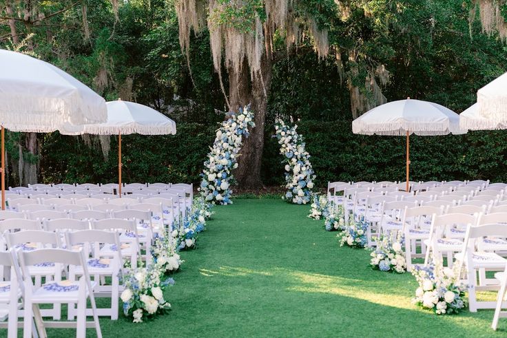 Lush blue and white aisle and altar florals for a classic ou