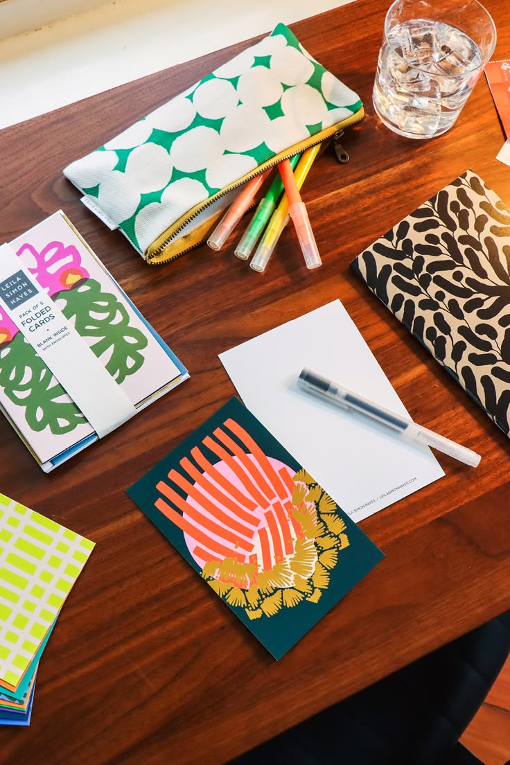 All hand drawn designs by artist Leila Simon Hayes. 

Folded