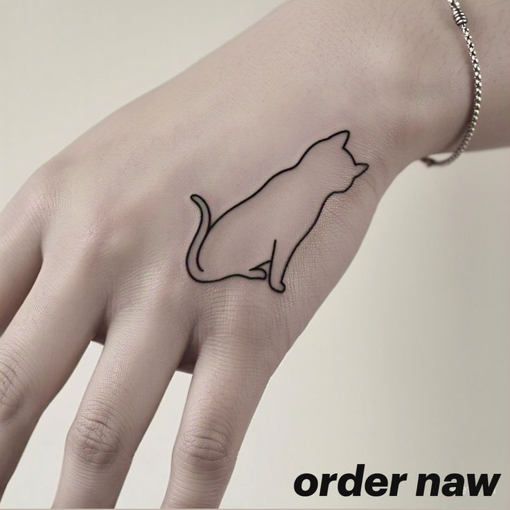 Looking for a subtle yet stylish tattoo? This minimalist cat