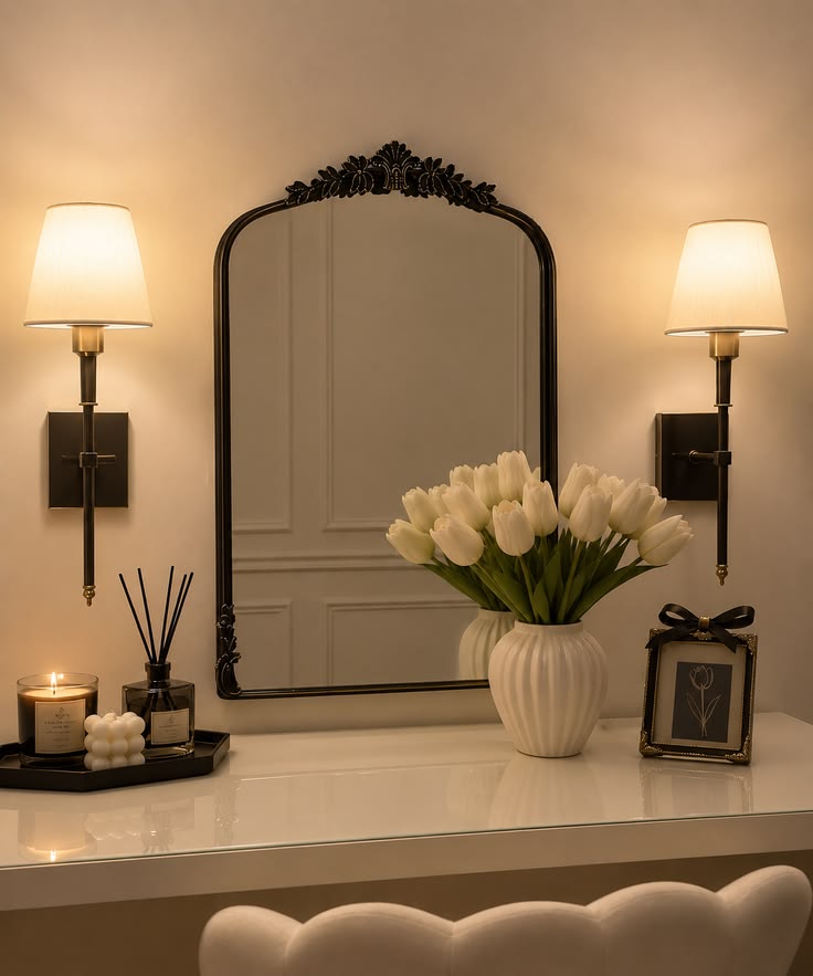 A classy vanity setup with a statement mirror, warm lighting