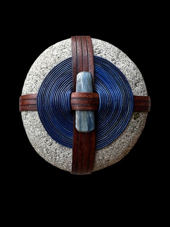 Beautifully wrapped rock with an added gem (kyanite)