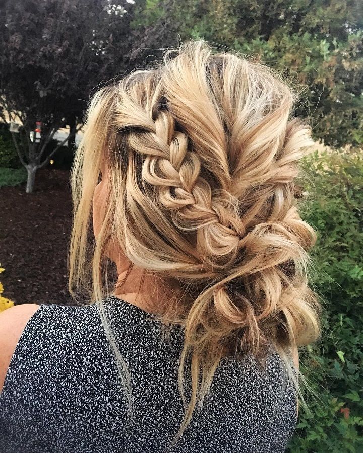this braided updo is messy, but also elegant. artfully messy