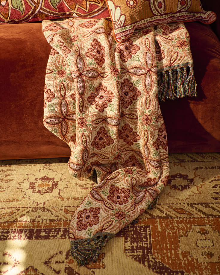 Patterned cushions, rich fabrics and a textured throw come t