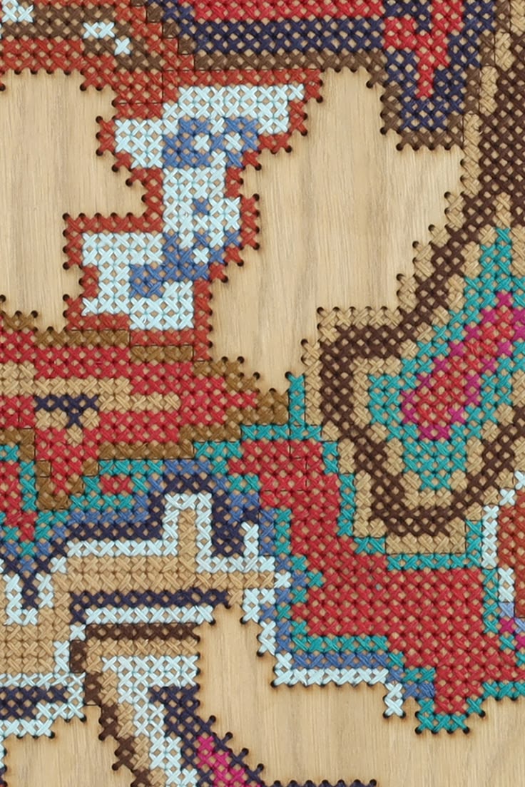 A hand-embroidered wooden surface developed using Cross Stit