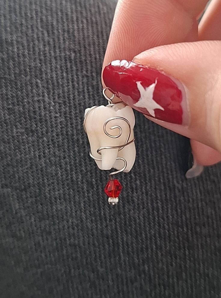 This is a little charm I made from my wisdom tooth. It might