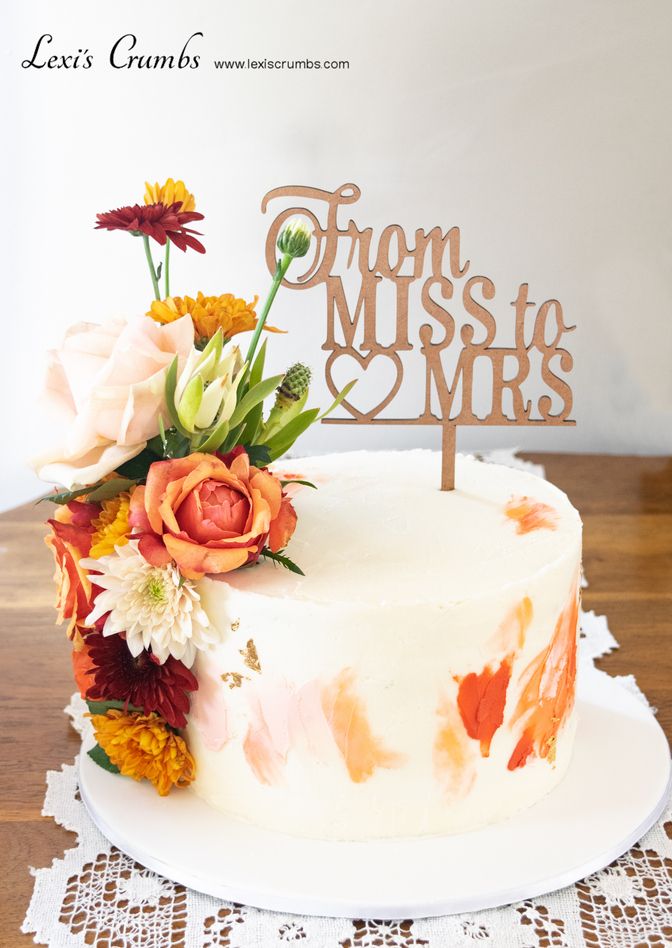 Rustic bridal shower cake with fresh blooms. From Miss to Mr