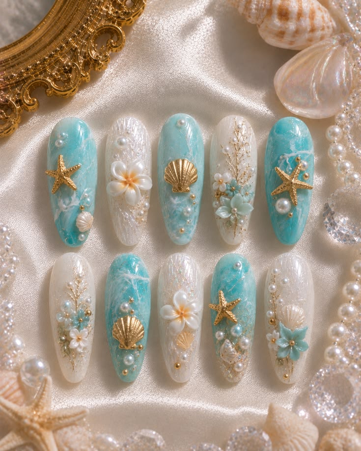Starfish, seashells, and ocean blues — beach day nails done 