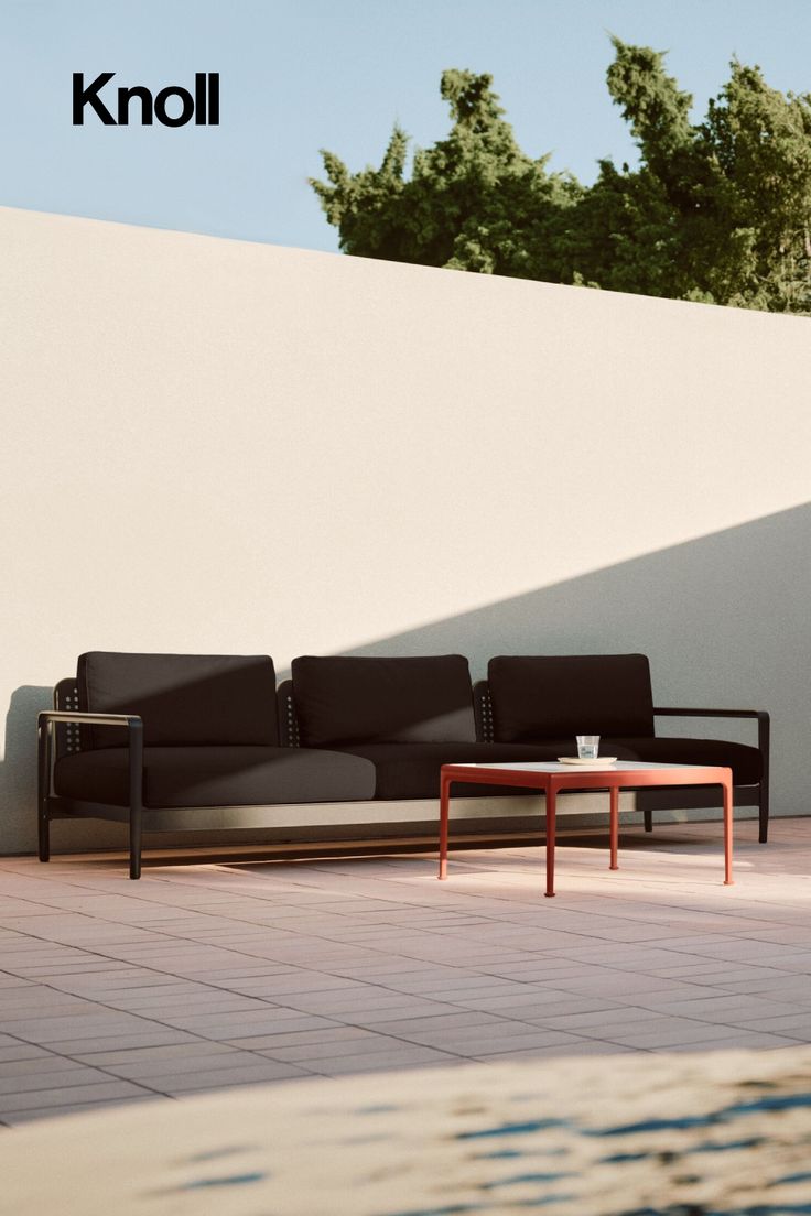 The Lissoni Outdoor Sofa in black brings bold contrast and t