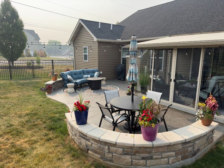Stamped Concrete Patio with Stone Veneer Wall