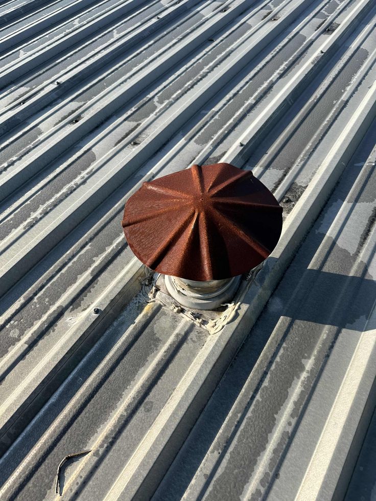 We located a rusty vent cap on this metal roof that we are r