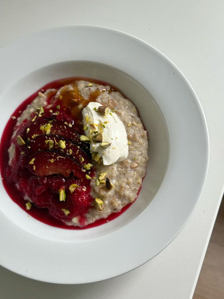 Porridge, plum, pistachios