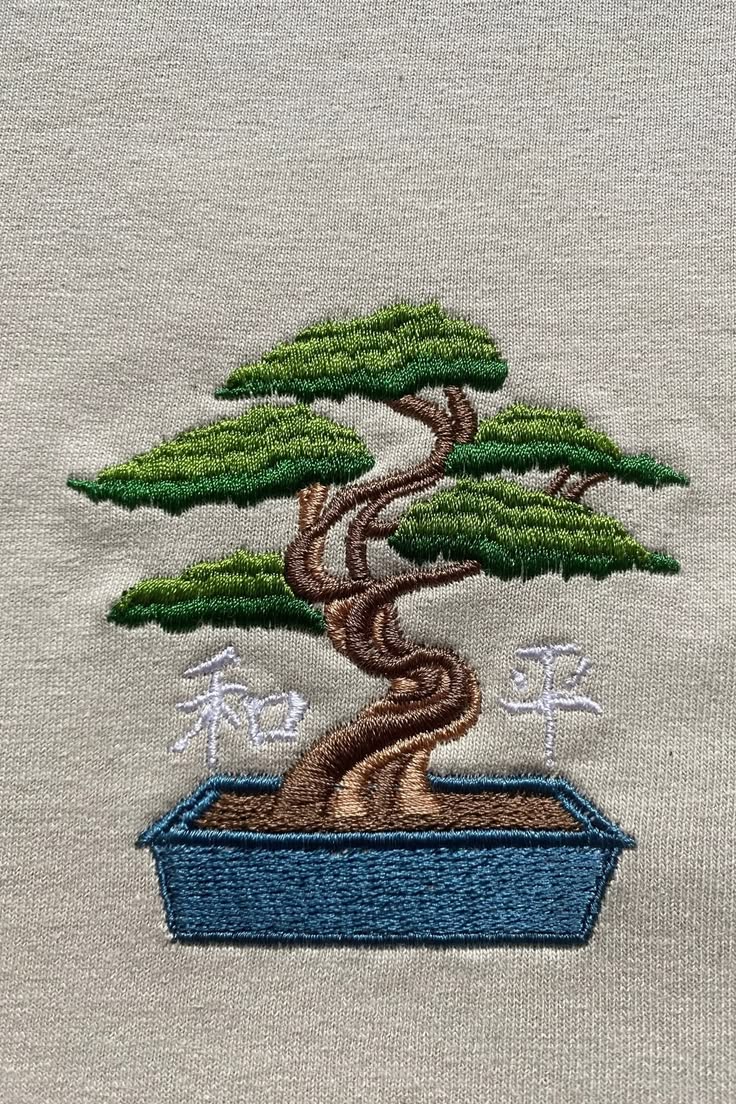 Embroidered Bonsai tree surrounded by peace and harmony. CHE
