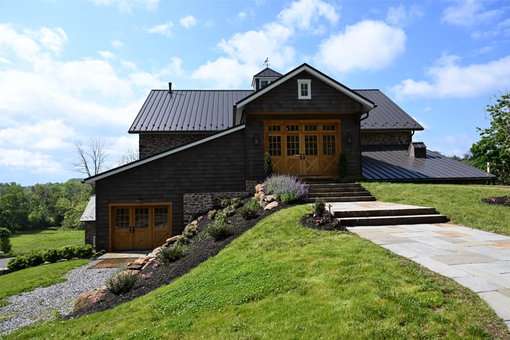Perfect example of a bank barn.  The building was built into