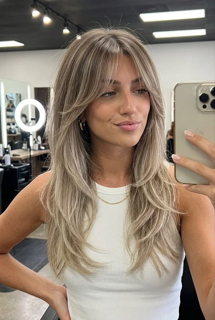 Gorgeous long ash blonde ombré hair with subtle face-framing