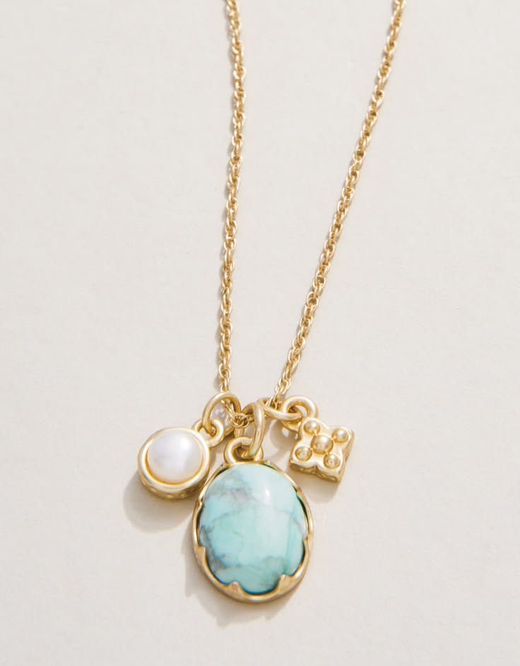 Symbolizing healing, peace, and balance, this charm necklace