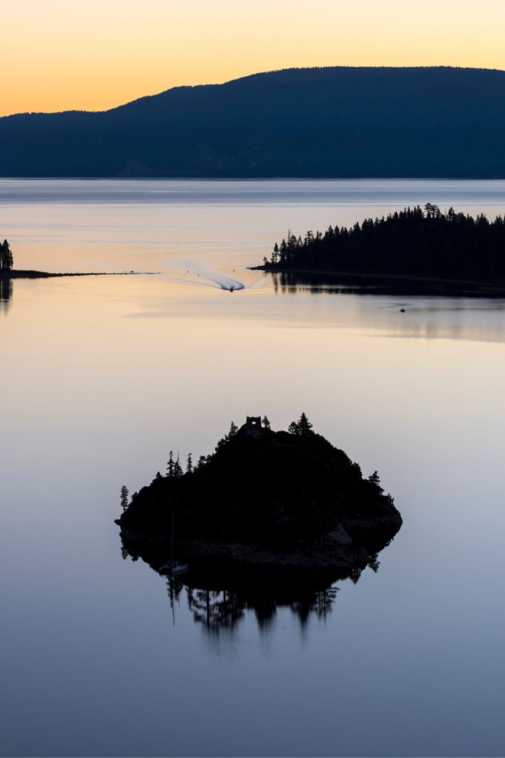Emerging from the clear turquoise waters of Emerald Bay is F