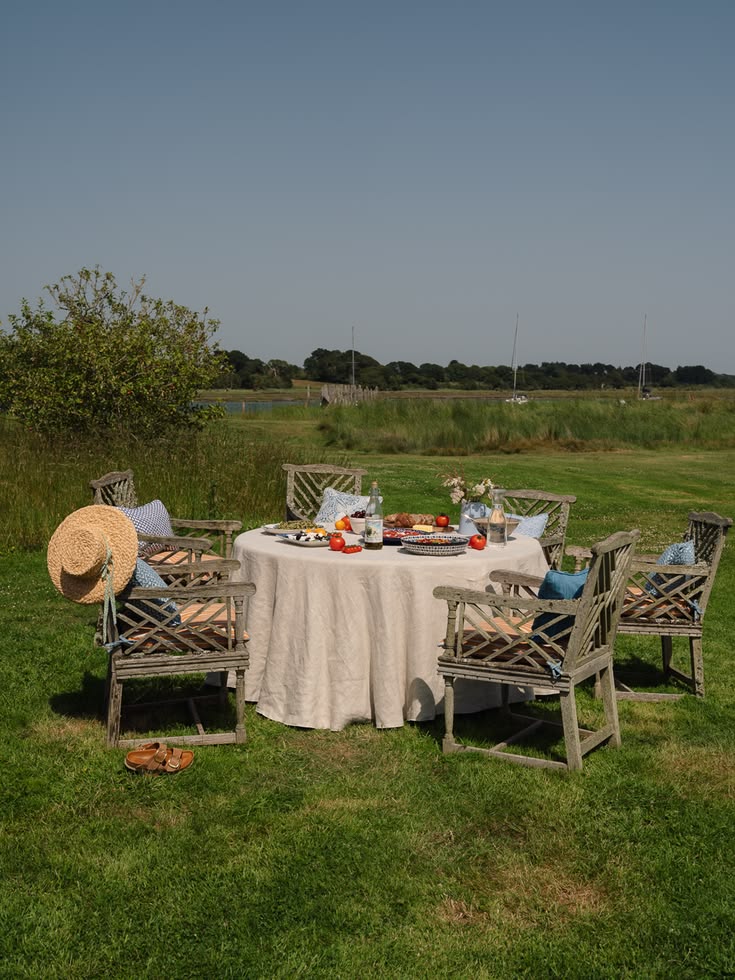 A beautiful table laid with the best of the summer and chair