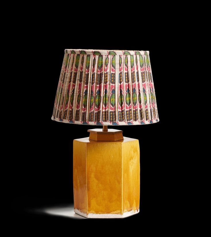 Bring sunshine into your home with a yellow ceramic lamp bas