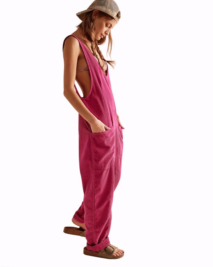 Model poses wearing pink We The Free High Roller Cord Jumpsu