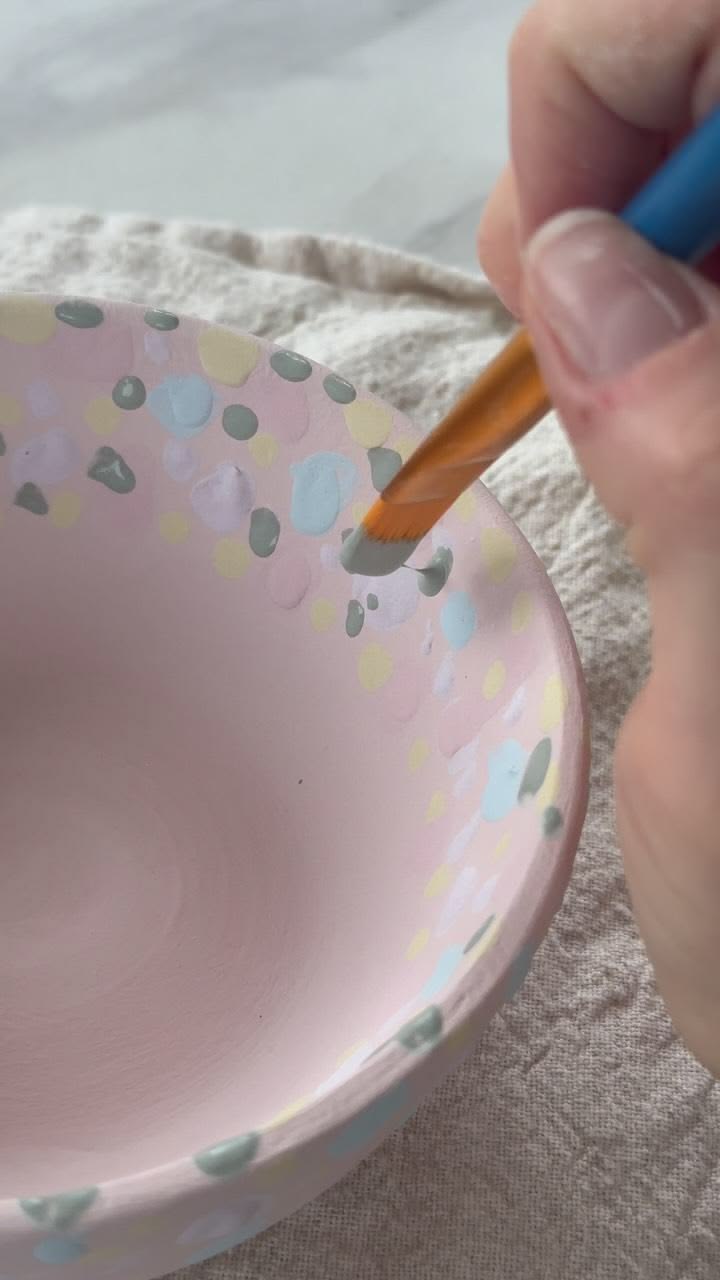 Playing with glaze in the design studio.