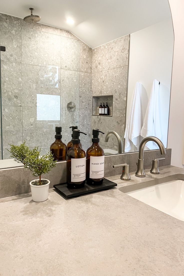 Upgrade your bathroom with our sleek refillable soap and sho