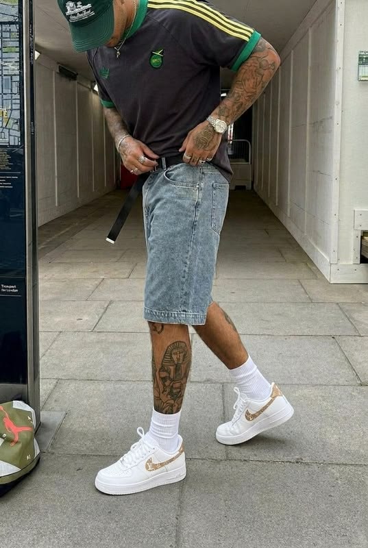 Custom Air Force 1 sneakers styled with denim shorts in an u