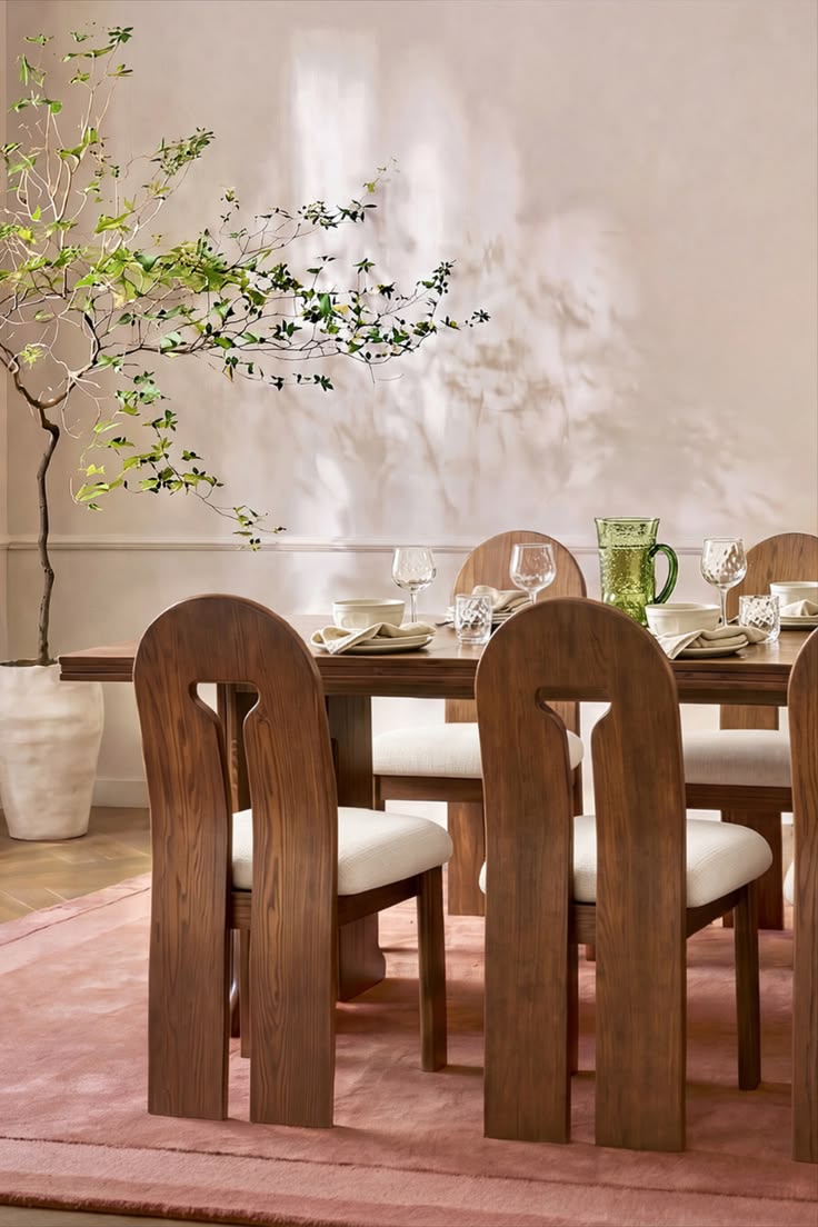 Bold sculptural panel legs in solid oak. A double-edge table