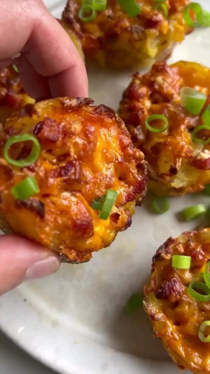 Smashed baked potatoes baked in muffins tin filled with sour