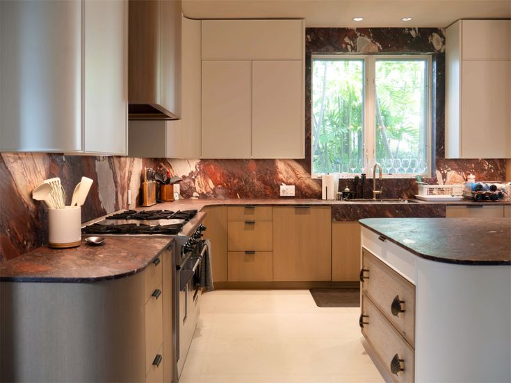 Custom Miami kitchen with wrap-around bleached walnut and pa