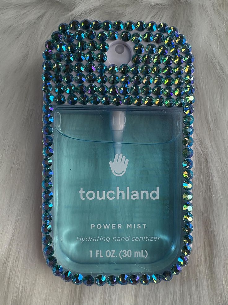 Blinged and bedazzled, handplaced  rhinestones embellish thi