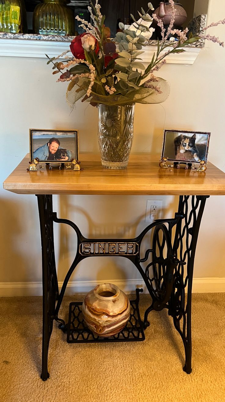 We put this Singer sewing machine table in our living room t