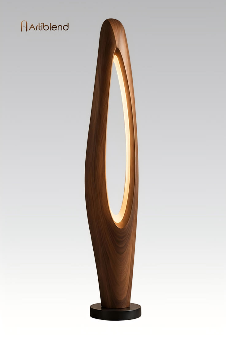 An elongated wooden floor lamp with a warm oval opening brin