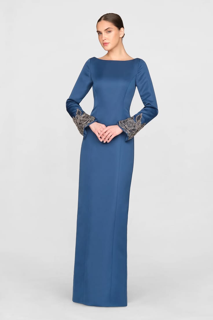 Rose-embroidered cuffs frame the long sleeves of this duches