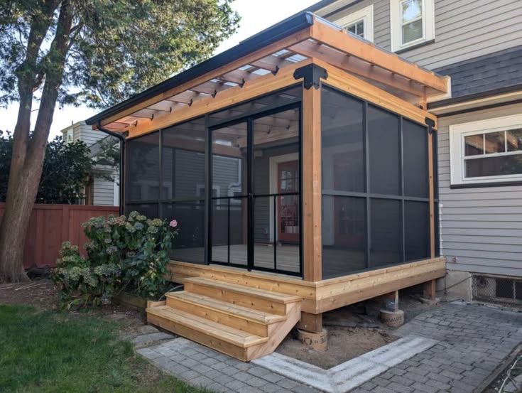 Custom catio with cedar deck, polycarbonate roof, and pet-sa