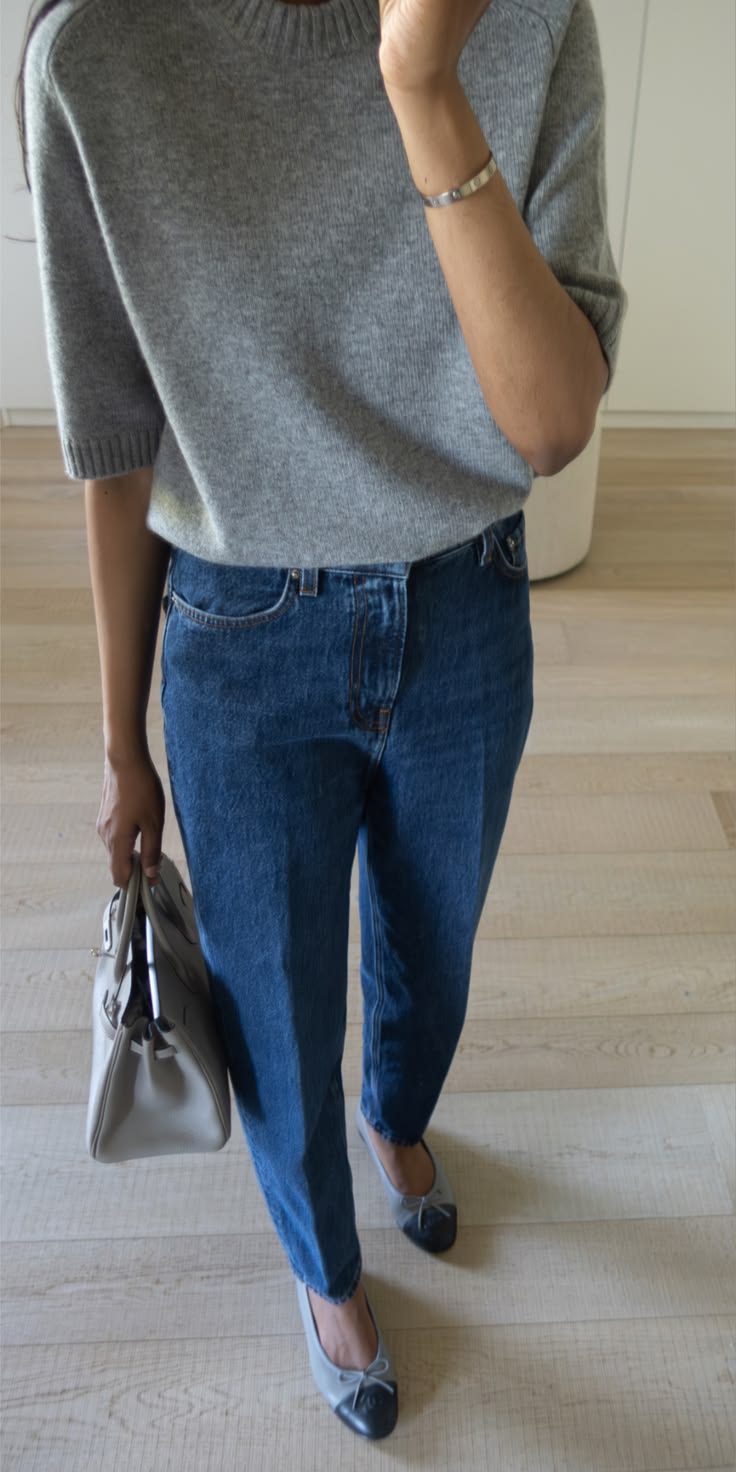 A simple cashmere tee and jeans styled with a Hermes Birkin 