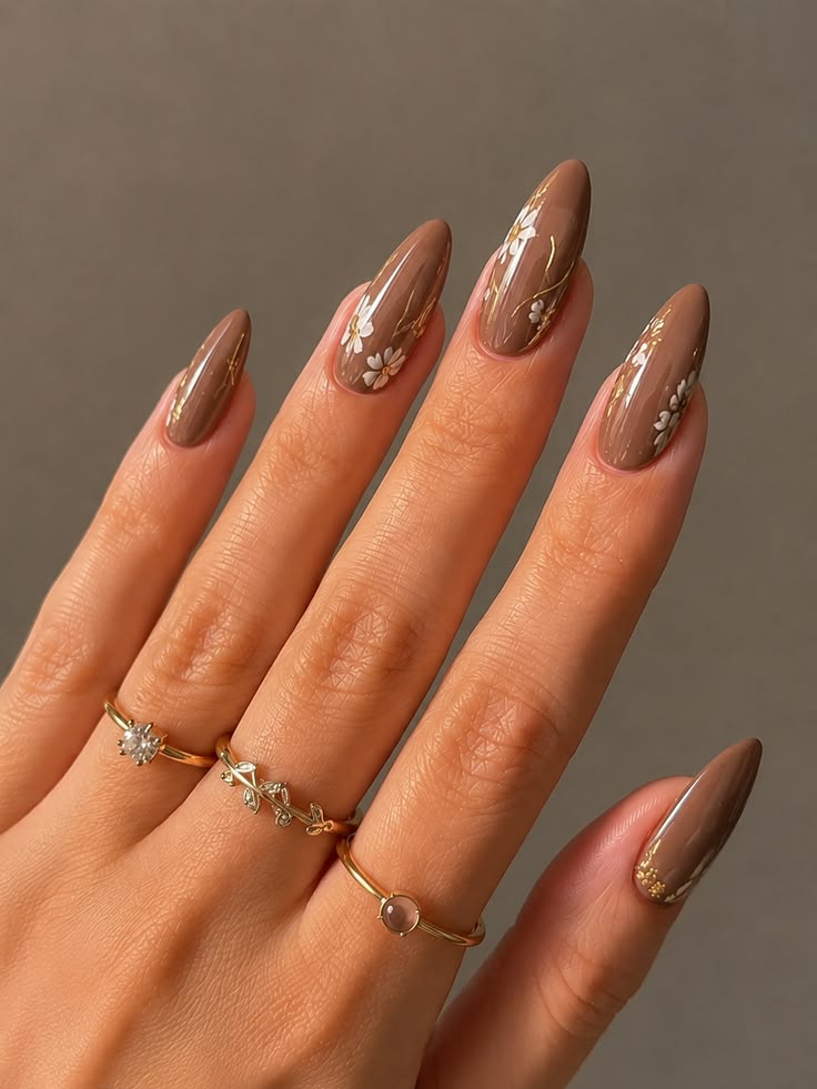 A stunning close-up of glossy mocha brown nails featuring de
