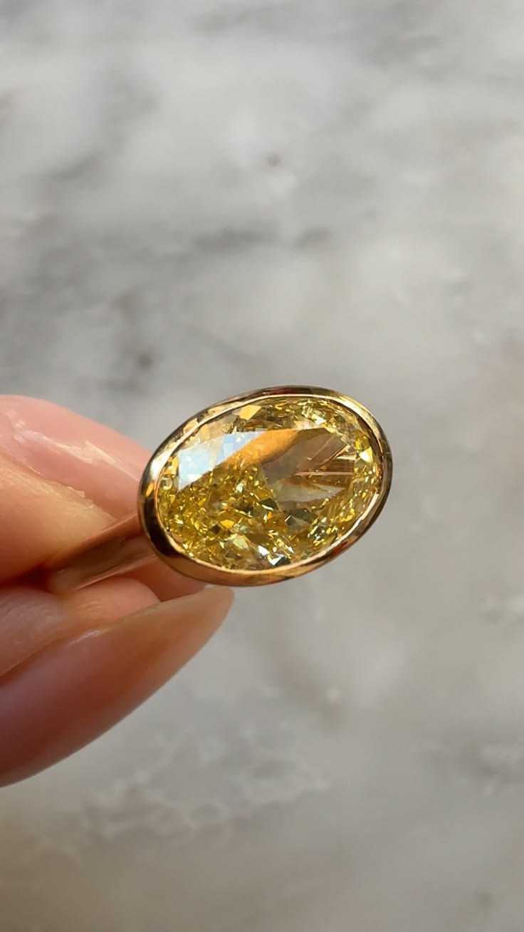 Such a cool girl ring - the yellow diamond bezel solitaire.