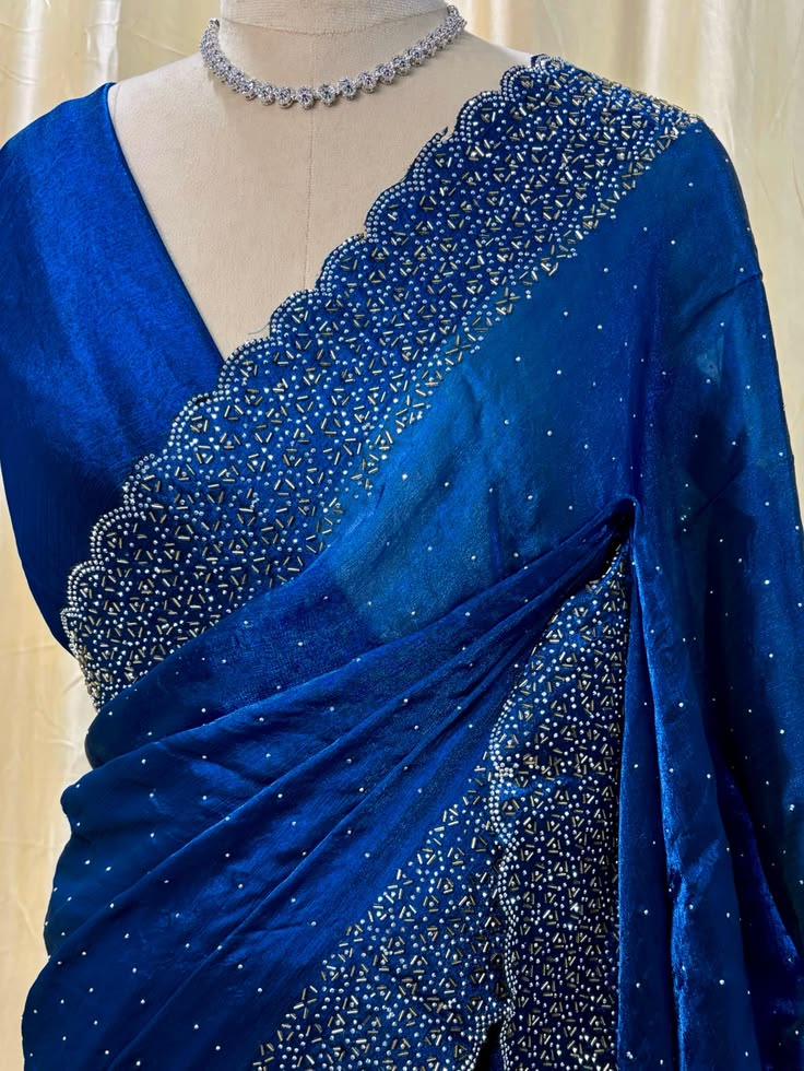 SAREE: Teal blue Georgette saree comes with sequence and sto