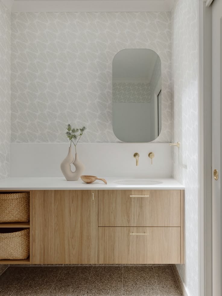Soft neutrals, warm timber and Brushed Brass details give th