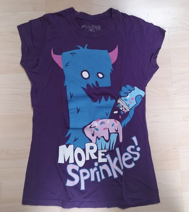 blue monster with pink horns and cupcake "more sprinkles" pu