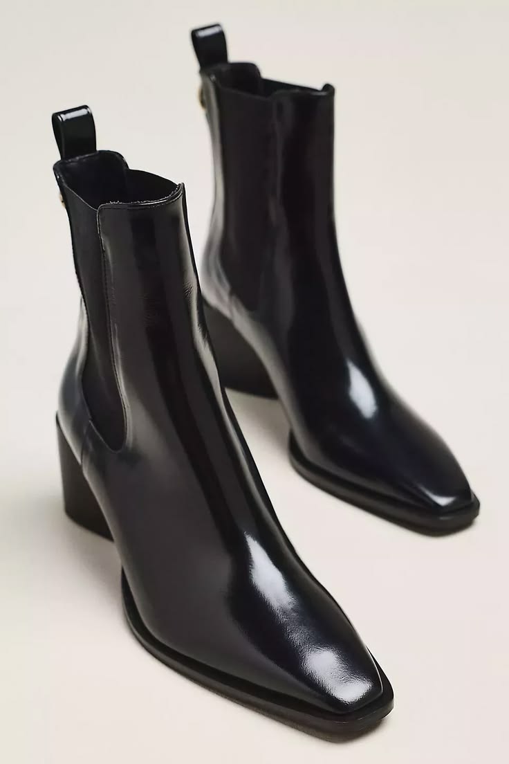 Elevate autumn fashion with sleek black Chelsea boots. Luxur