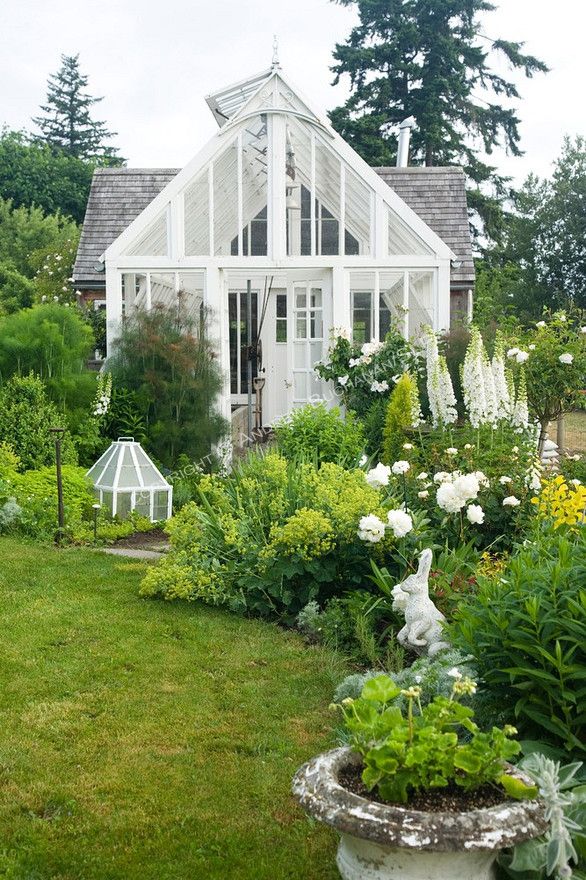 Victorian-style greenhouse salvaged and painted white