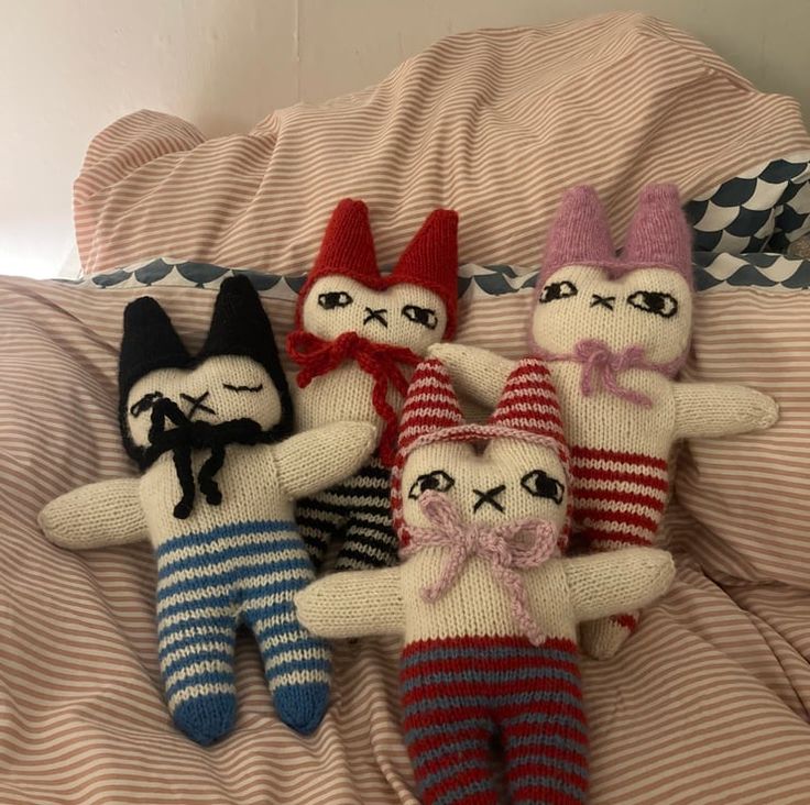 Hand knitted rabbit toy completely one of a kind. With a bon