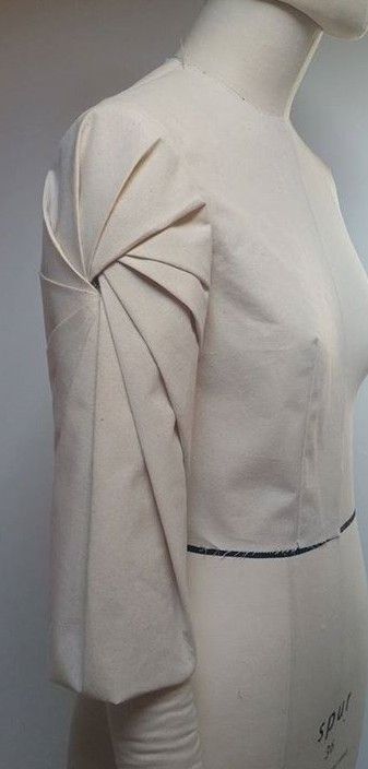 Innovative Pattern Cutting - spiral pleated sleeve detail; f