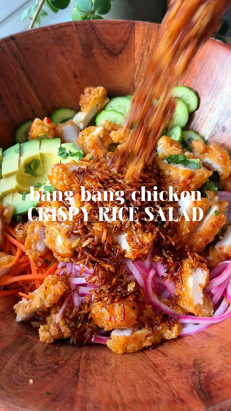 Bang bang chicken crispy rice salad features golden crispy r