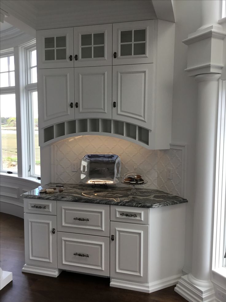 The Sub Zero refrigerator drawers are hidden behind the gorg