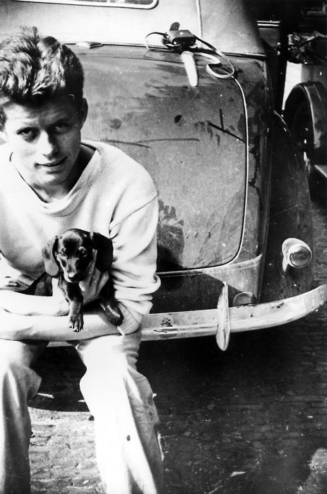 JFK at 20 years old in Europe, summer of 1937. In his arms: 