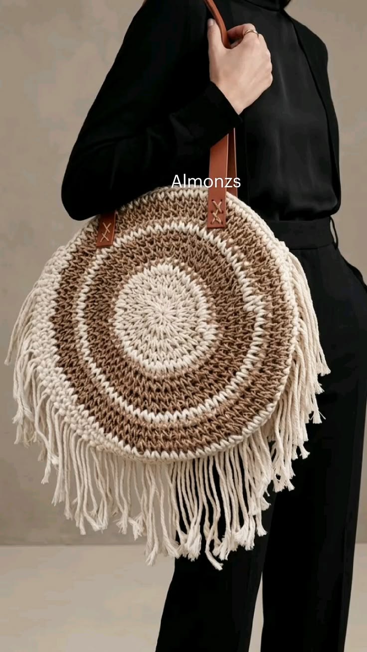 Handmade raffia tote featuring macrame fringe and a round cr
